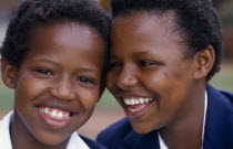 Portrait of two laughing schoolgirls.