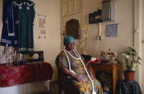 Portrait of Zionist uniform maker in home / workshop.South African protestant christianity