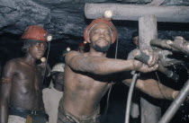 Gold miners working underground.