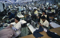 Workers on factory floor of the Epping Industries Florida Clothing Company.