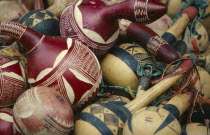 Decorated calabash shakers for sale at market.craft  instrument rattle