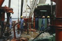 Workers on oil rig.