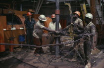 Workers on oil rig.