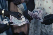Cropped shot of money changing hands.transaction  sale