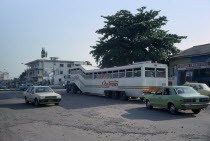 Street scene with bus and other traffic. Zaire