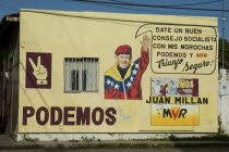 Mural depicting image of President Hugo Chavez  pro socialism slogan and PODEMOS and MVR political parties.