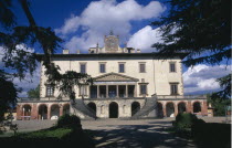 Villa Medici Poggio a Caiano.  Country villa near Florence built by Lorenzo the Magnificent.  Exterior facade framed by trees.