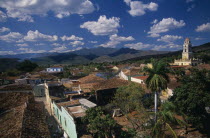 View across red tiled city rooftops towards Iglesia San Franciso de Paula bell tower.church