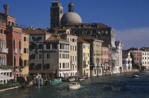 The Grand Canal and water traffic overlooked by the Hotel Continental with dome of San Geremia behind.
