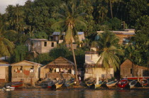 Town houses with lush vegetation behind.