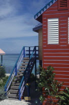 Compass Point.  Architectural detail showing roof vent and window shutters.ventilation