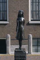 Westermarkt. Statue of Anne Frank the young diary writer during the Nazi occupation of World War IINetherlands