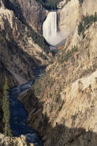 Grand Canyon of  Yellowstone with waterfall cascading into river below