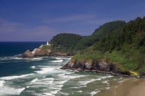 View along the rocky coast to Heceta Head Lighthouse in the distance