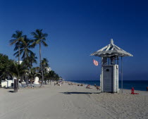 View along beach with lifeguard hut