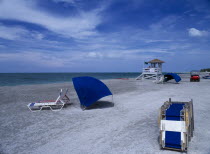 Lido Beach. Blue Sun Loungers and Lifeguard Hut on sandy beach