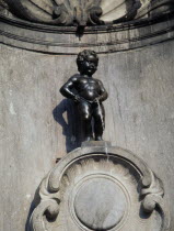 Manneken Pis  a statue of a little boy urinating into the fountains basin.