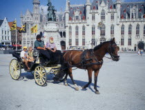 A horse drawn tourist carriage in the Main Square  Grote Markt.