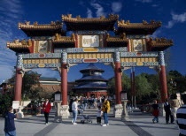 Walt Disney Epcot Center Chinese Showcase with visitors entering the China Pavilion through a large colourful Chinese gate with the Temple of Heaven seen further alongAmerican Asia Centre Chungkuo Co...