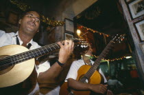 Guitarists playing in La Bodeguita del Medio.