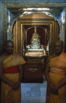 Temple of The Tooth. Guardians of the Tooth standing outside the room holding the visible Casket of The Tooth Dalada Maligawa