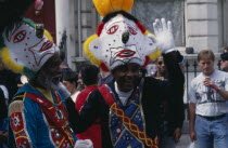 People in clown costumes at the Notting Hill carnival