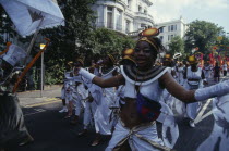 Carnival dancers in white costumes