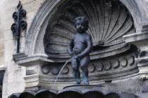 Manneken Pis  a statue of a little boy urinating into the fountains basin.