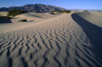 View over rippled desert sands and arid landscape