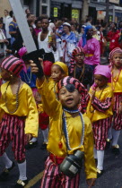 Children in pirate costumes during parade.
