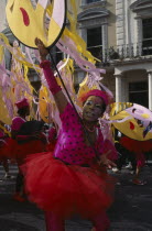 Notting Hill Carnival dancer wearing a pink and red costume