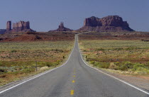 Blacktop road running into the distance towards the Mettens