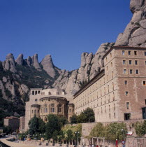 Spain, Catalonia, Montserrat, Monastery at the base of the mountains.