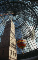 Looking up at the old Shot Tower  hot air balloon and bi-plane inside Melbourne shopping centre. Center
