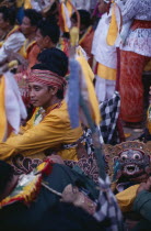 Young man amongst crowd during festival celebrations.
