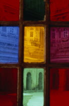 Jodhpur fort seen through coloured rectangles of stained glass door. Colored