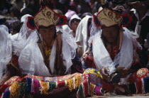 Lamas wearing kartas receiving offerings from pilgrims during Hemis Festival to celebrate the birth of Guru Padmasambhava  founder of Tibetan Buddhism. monastery