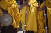 Tibetan Buddhist lamas in ceremonial yellow dress with traditional instruments attending annual Hemis Festival to celebrate birth of the founder of Tibetan Buddhism.   monastery