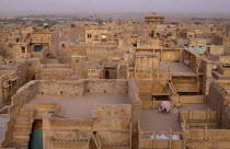View over flat roof houses of desert town.