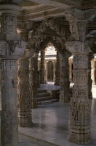 Dilwara Temple complex dating from 11th-13th century A.D.  Detail of intricately carved and ornamented white marble ceiling and supporting pillars.
