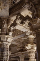 Dilwara Temple complex dating from 11th-13th century A.D.  Detail of intricately carved and ornamented white marble ceiling and pillars.
