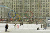 Repairing square in downtown Dalian displaying Olympic symbolAsia  Dalian  Olympic