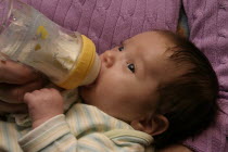 Kylan Stone drinking from bottle.  Girl