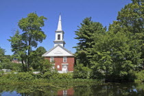 Community church refelected in pond.