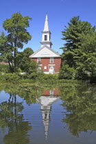 Community church refelected in pond.
