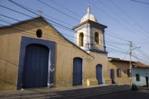 Church in colonial section of Petare  with telephone and power cables in the foreground.