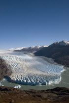 Early morning view of Glacier OHiggins with the Southern Ice fields  Hielo Sur  in the background. Trek from Glacier Chico  Chile  to El Chalten  Argentina