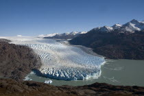 Early morning view of Glacier OHiggins with the Southern Ice fields  Hielo Sur  in the background. Trek from Glacier Chico  Chile  to El Chalten  Argentina