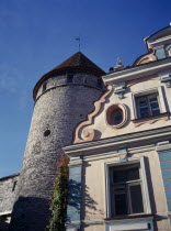 Uus Street.  Old Town building facade and circular tower.Eastern Europe