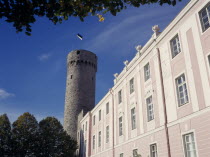 Hermann Tower and Tallinn Castle part framed by tree branches.Eastern Europe